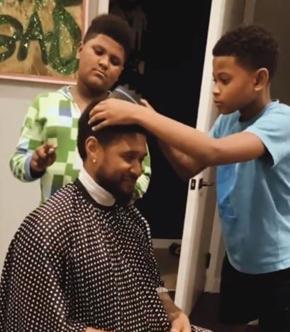 Usher Cinco Raymond V and his brother giving a haircut to his dad, Usher.